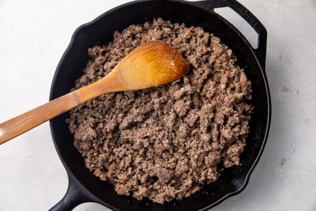 Browned sausage in a cast iron skillet