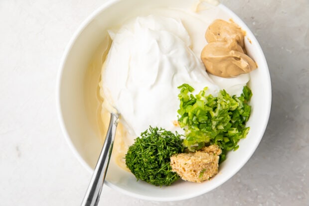 Ingredients for horseradish sauce in a white bowl