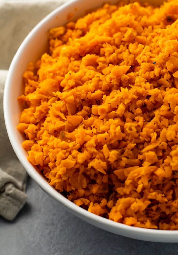 Sweet potato rice in a white bowl