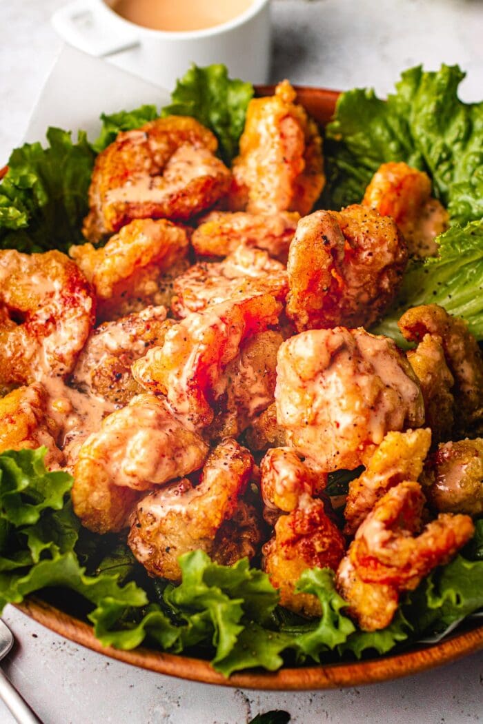 Paleo bang bang shrimp on a bed of lettuce