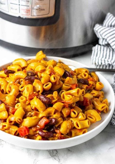 Vegan chili mac and cheese in front of an Instant Pot