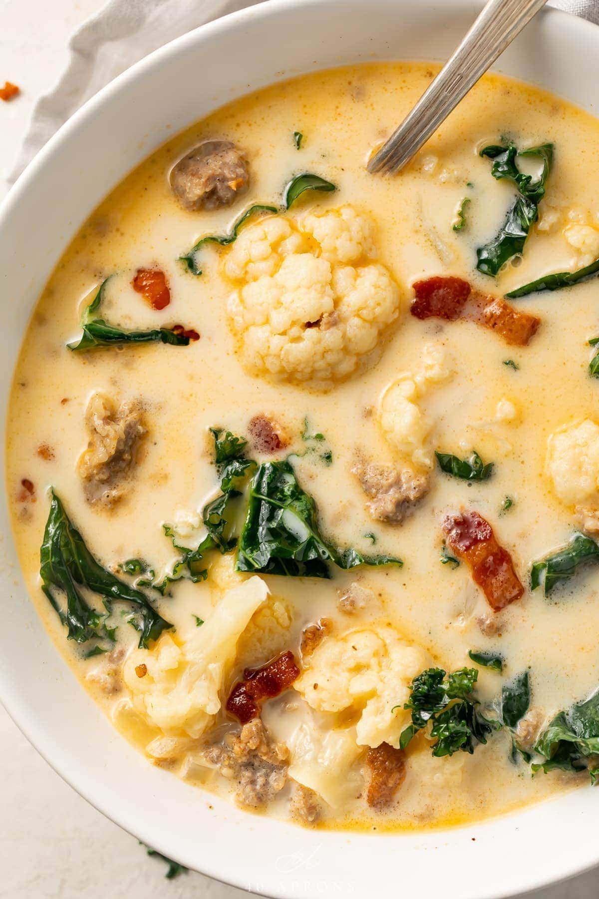 Close up photo of low carb zuppa toscana in a white bowl