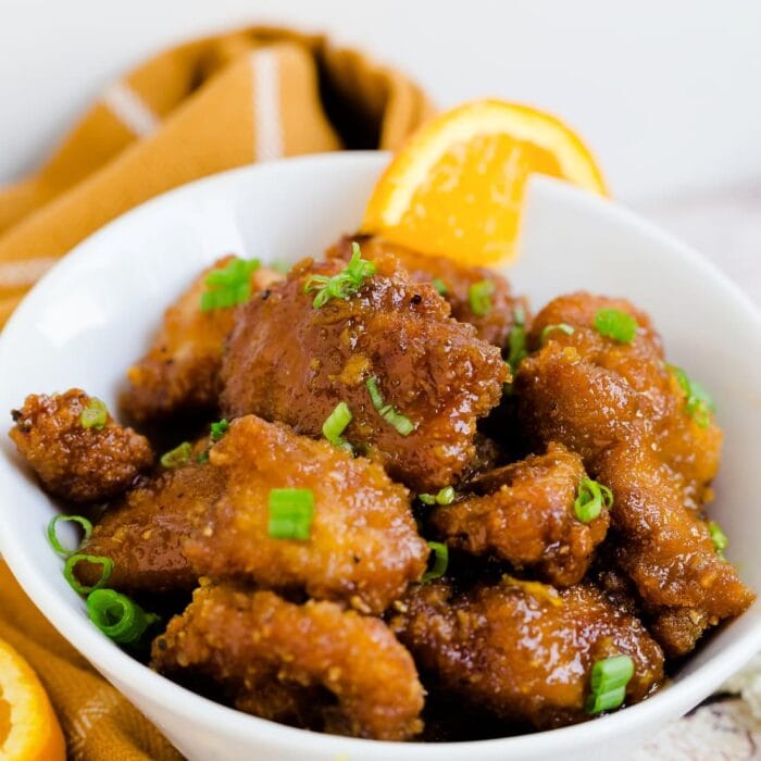 Air fryer keto orange chicken in a white bowl