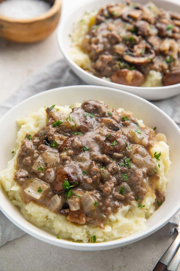 Plated whole30 beef stroganoff with mushroom gravy on top of mashed potatoes