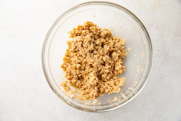 Vegan butter and sugars in a glass mixing bowl