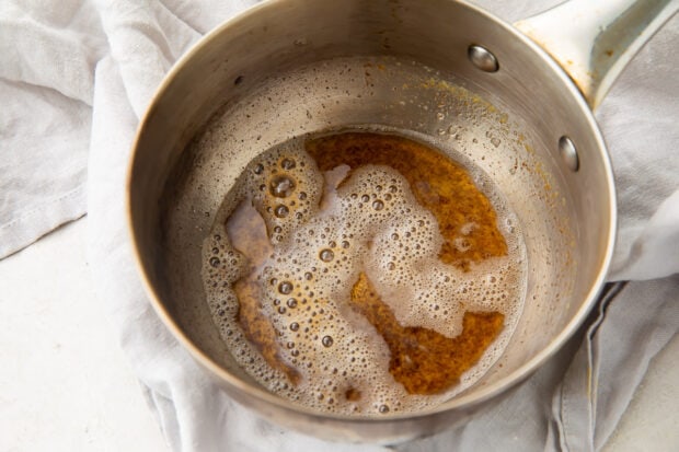 Browned butter in a silver saucepan