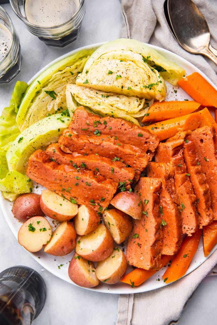 Platter of vegan corned beef and cabbage with potatoes and carrots