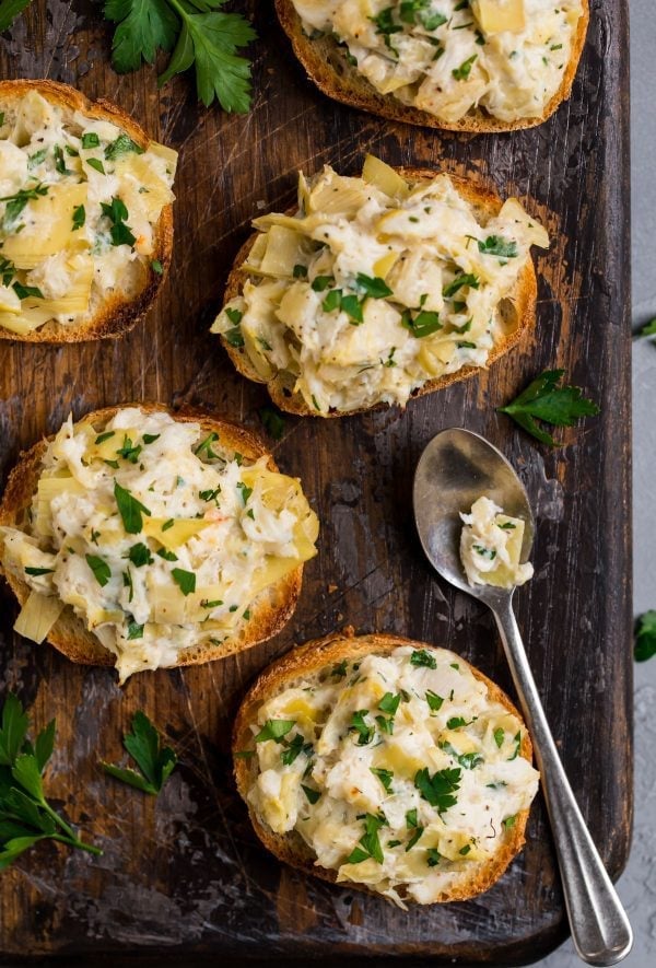 Small crostinis topped with an artichoke crab salad