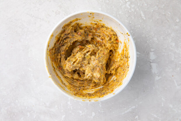 Lemon pepper butter mixture in a small white bowl