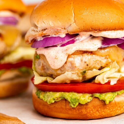 Close-up image of chicken burgers with chipotle aioli.