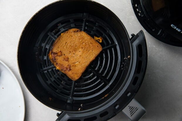 Grilled cheese sandwich in air fryer basket