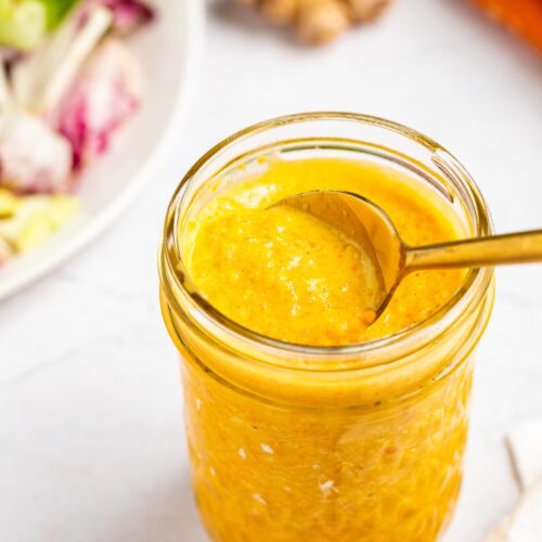 Japanese salad dressing in a jar with a spoon.