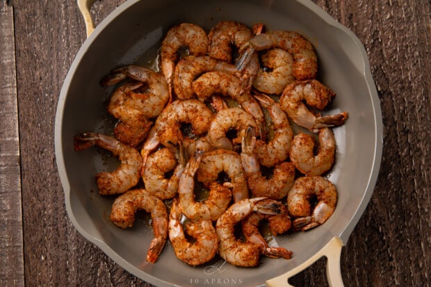 Blackened shrimp in skillet.