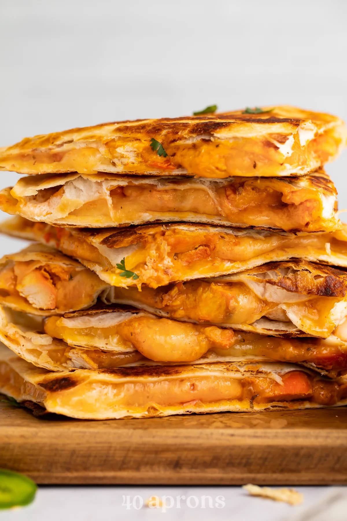 6 Chicken tikka masala quesadilla wedges stacked on top of eacher.