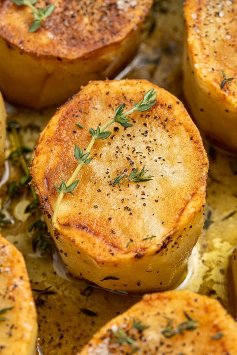 close-up image of fondant potatoes in a skiller