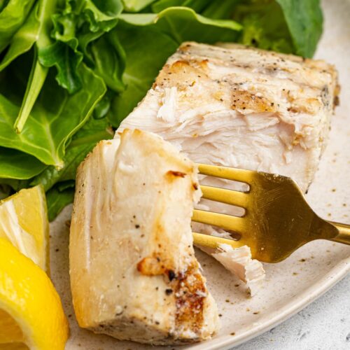 close up image of grilled mahi mahi on a plate