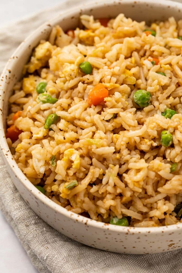 Angled view of a large bowl of ginger fried rice