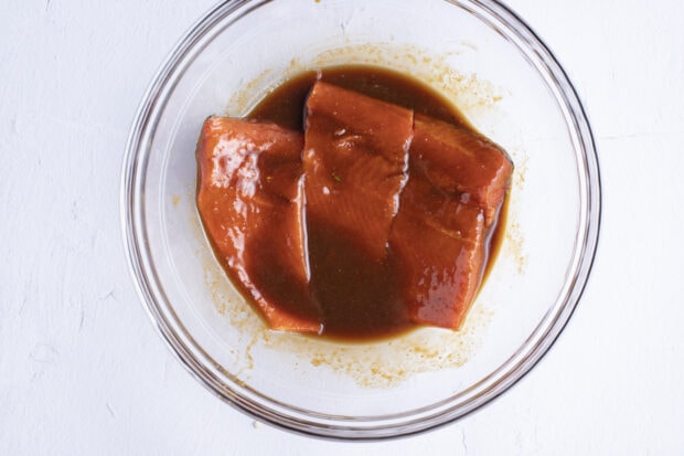 Salmon fillets in large glass bowl