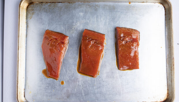 Miso salmon fillets on baking sheet