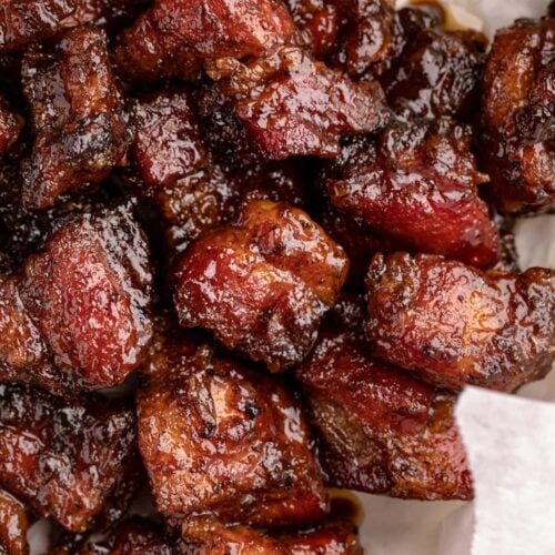 Pork belly burnt ends in a white bowl