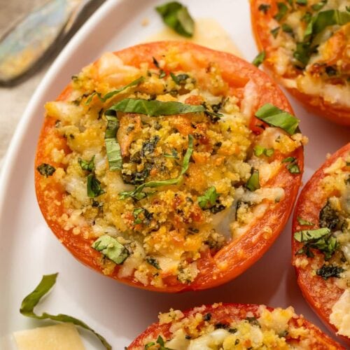 Close up photo of a stuffed tomato on a plate