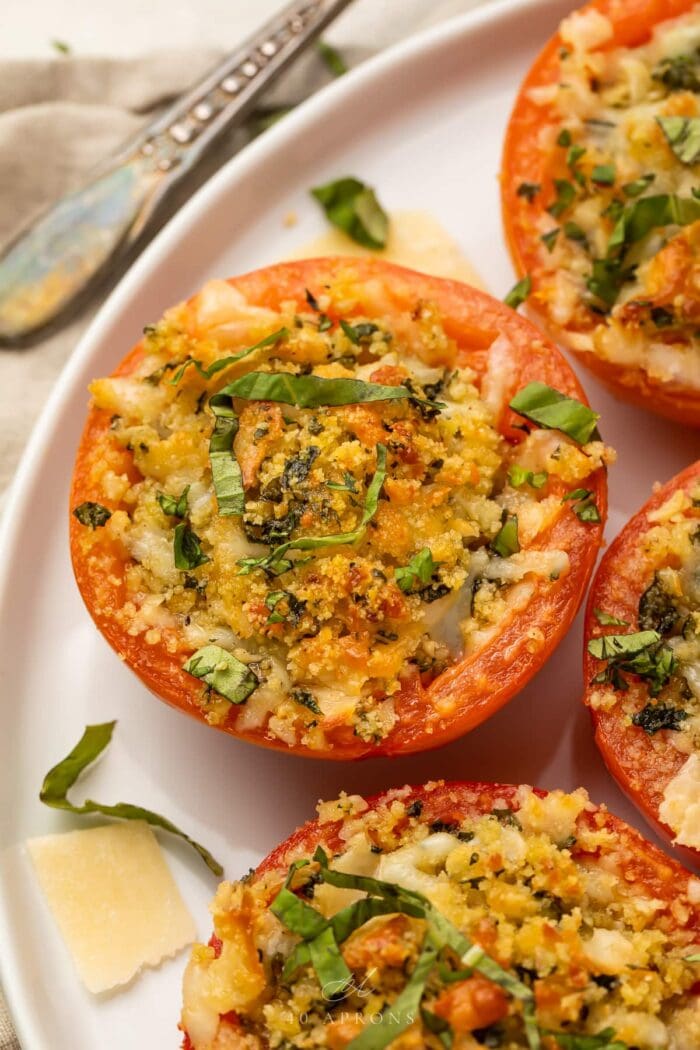 Close up photo of a stuffed tomato on a plate