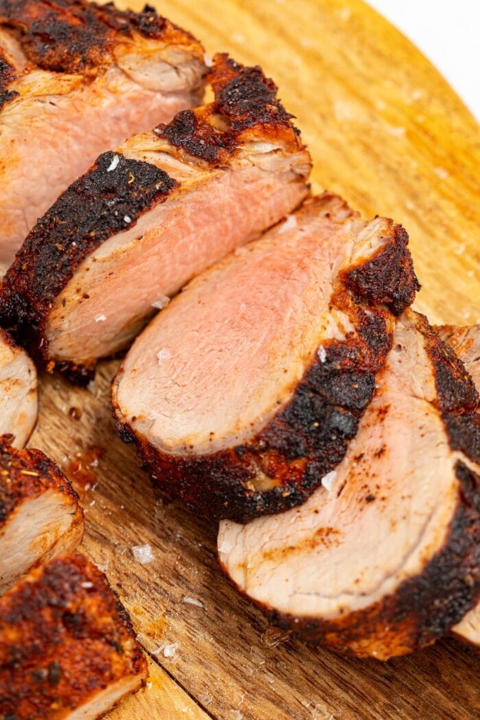 sliced air fryer pork tenderloin on a cutting board