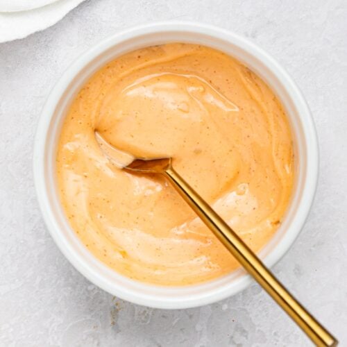 spicy mayo in a bowl with a spoon