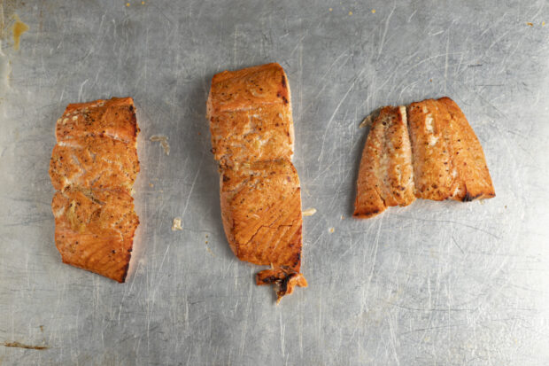 Broiled salmon fillets on baking sheet