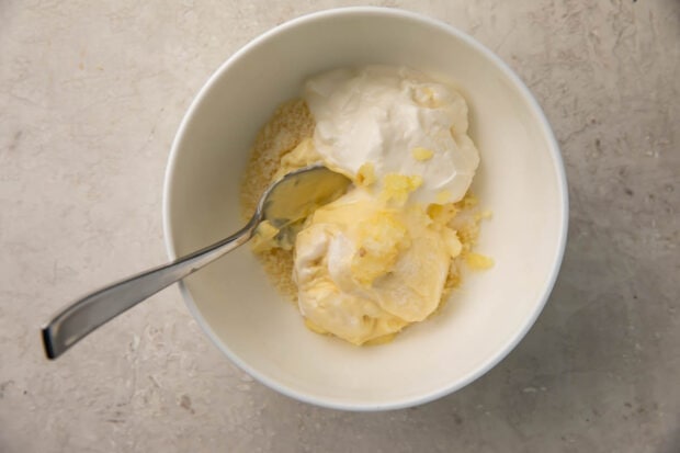 Ingredients for creamy parmesan dipping sauce in a bowl