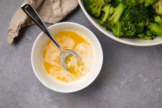 Lemon garlic butter sauce in a small white bowl