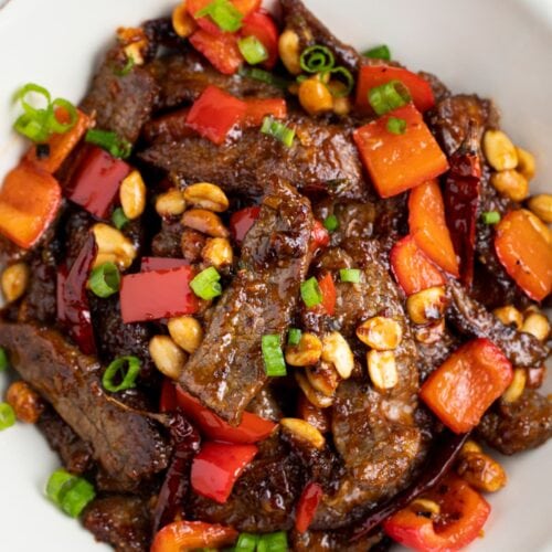 Kung pao beef in a white bowl