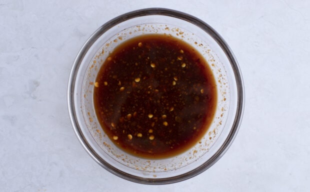 Kung pao beef sauce in large glass mixing bowl