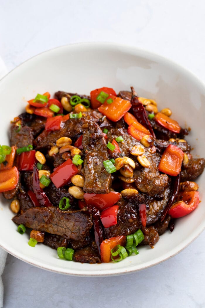 Kung pao beef in a white bowl