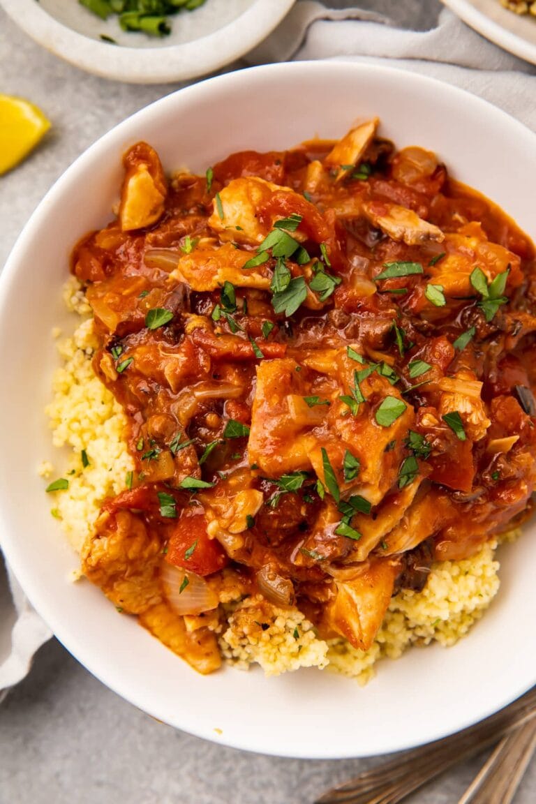 Overhead photo of Moroccan chicken stew in a white bowl