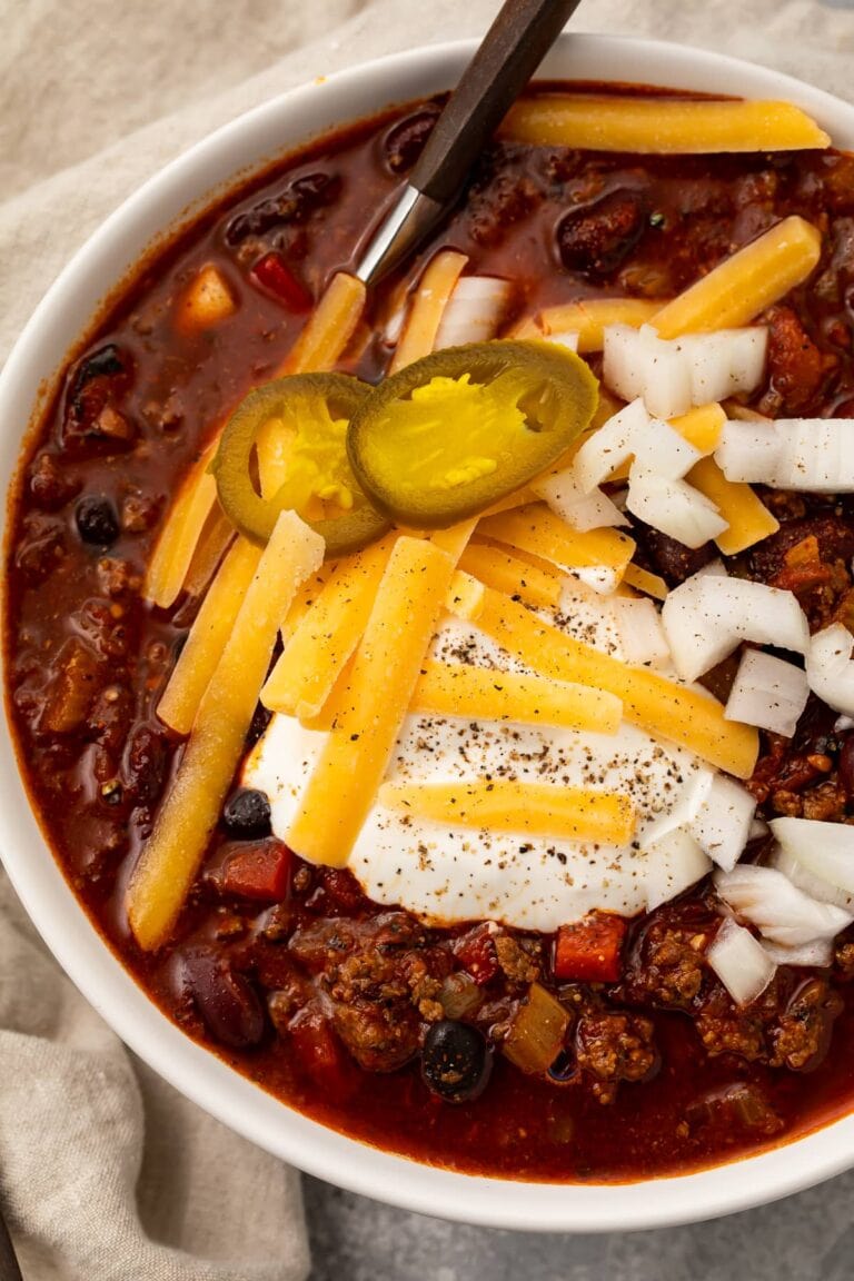 Overhead photo of nourishing slow cooker chili in a white bowl