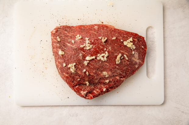 Seasoned tri tip on cutting board