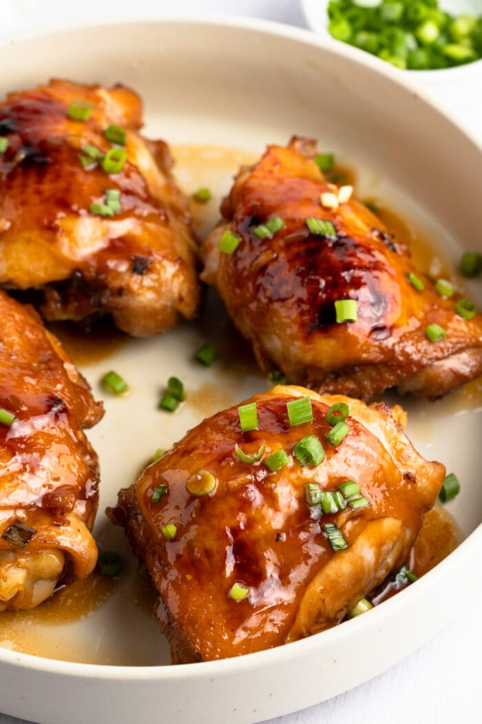 Shoyu chicken thighs in a round pan