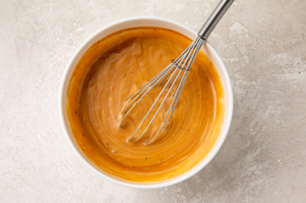 Copycat Chick-Fil-A sauce in a bowl with a whisk