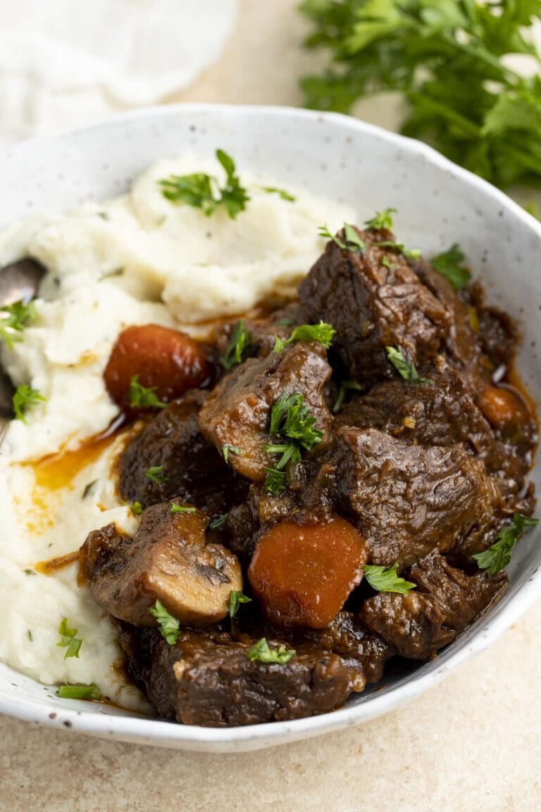 Keto beef stew with mashed cauliflower in a large bowl