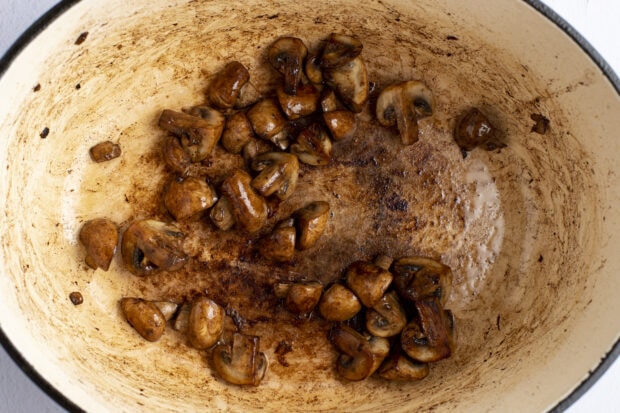 Mushrooms and oil in dutch oven.