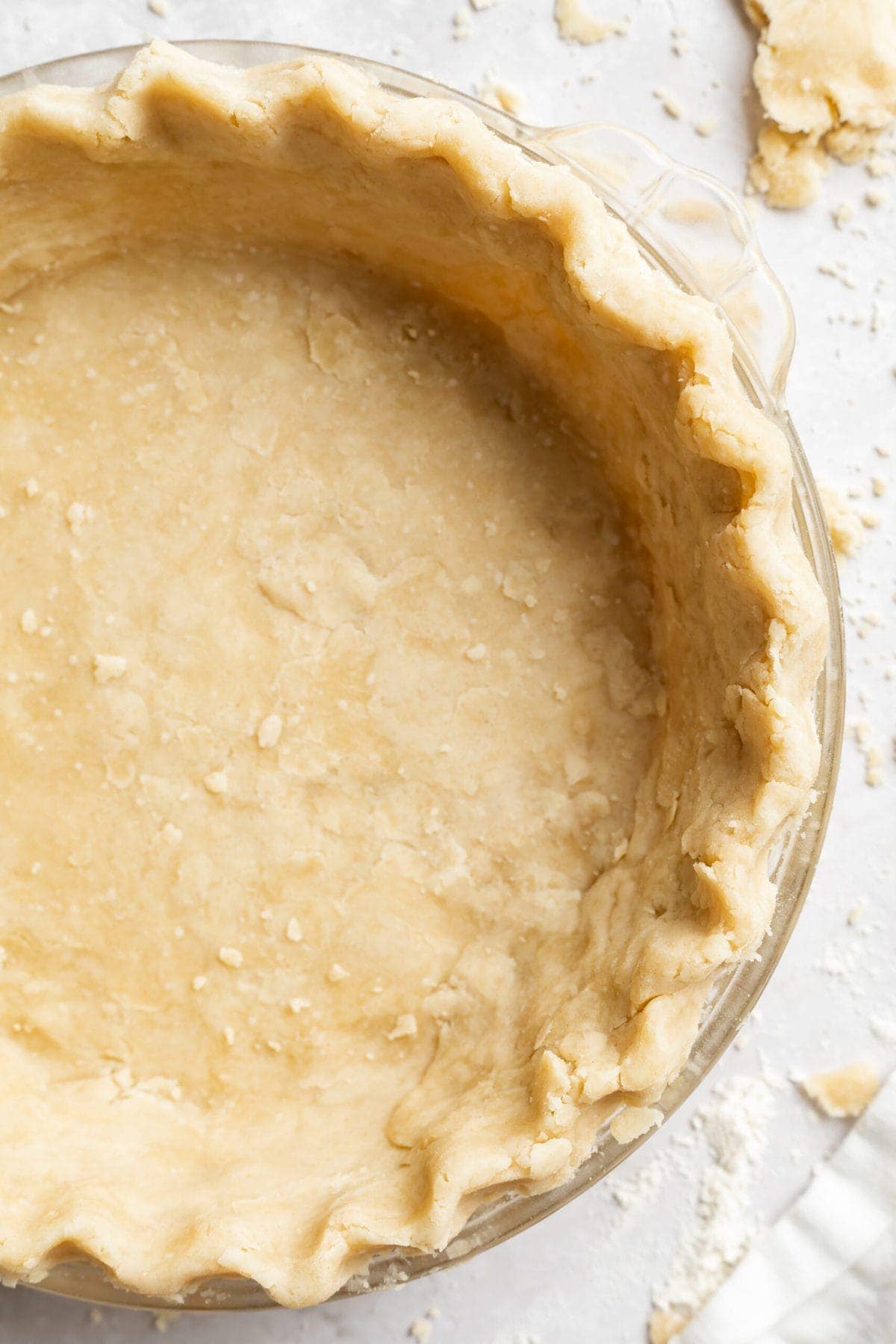 overhead image of vegan pie crust in a pie dish