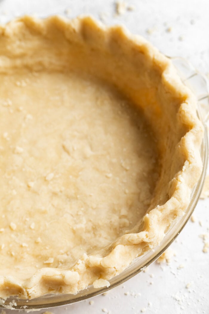 close up image of vegan pie crust in a pie dish