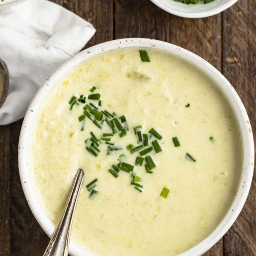 Overhead view of a bowl of cream of celery soup