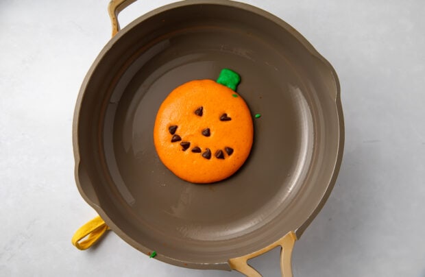 Jack o lantern pancake in skillet