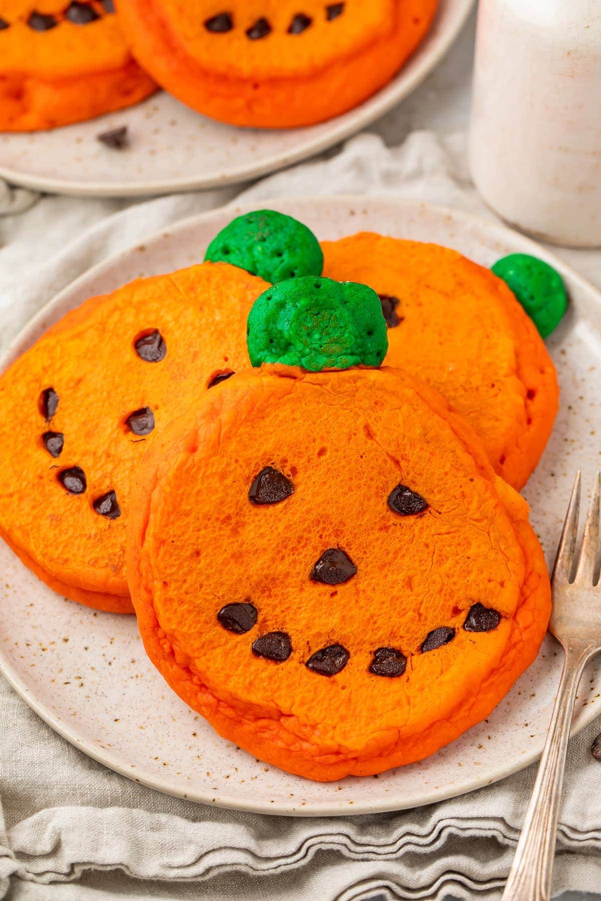 Super cute and easy jack o lantern pancakes on a plate