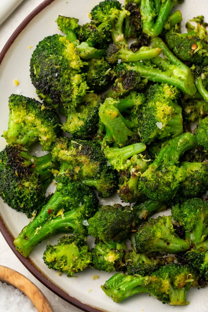 Sauteed broccoli on a white plate