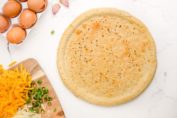 Golden pizza crust on countertop