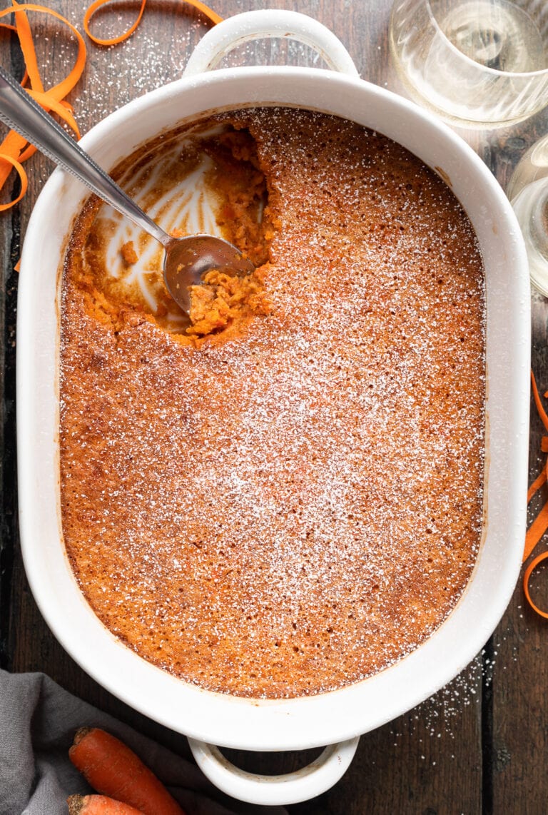 Overhead view of carrot soufflé in a white casserole dish