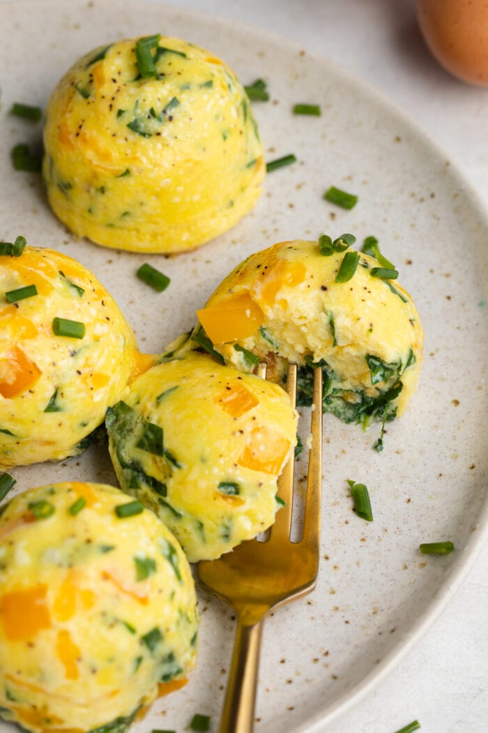 close-up image of instant pot egg bites on a plate with a fork